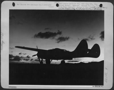 Consolidated > With The Moon Rising, Usually An Indication Of Enemy Aircraft Activity, A Marianas Based 7Th Aaf Northrop P-61 Black Widow Night Fighter Waits For The Crew Which Will Take Her Far Out Over The Water To Intercept Enemy Planes Intent On Attacking Our Positi