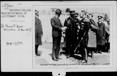 1924 > President Coolidge presenting medal to Lieutenant Thomas J. Ryan, White House