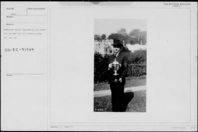 1924 > President Coolidge holding trophy for Army and Navy football game