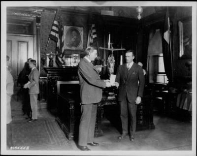 1926 > Godfrey Cabot presenting a trophy to Secretary of the Navy