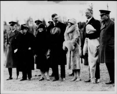 1926 > Mrs. Coolidge with Secretaries of War and Navy on football field