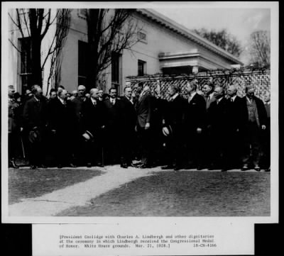 1928 > President Coolidge with Charles A Lindbergh and other dignitaries