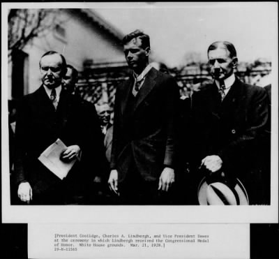1928 > President Coolidge with Charles A Lindbergh and other dignitaries