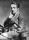 John_Tunstall_seated_pose_cropped_and_retouched.jpg