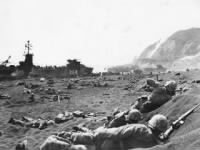 Marines burrow in the volcanic sand on the beach of Iwo_Jima.jpg