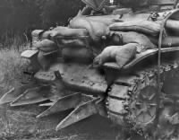 Sgt. Jasper E. Leonard, Sherman Tank, Outfitted With Hedge Cutter, Advances Toward Tessy, Normandy.jpg
