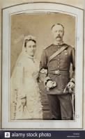 father-and-mother-frederick-and-florence-bailey-parents-of-frederick-marshman-bailey-wedding-photograph-the-groom-is-wearing-a-uniform-c-1880-albumen-print-63x104mm-source-photo-10832128-author-anon-R5JE32.jpg