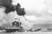 USS Oklahona (BB-37) burns in Pearl Harbor.jpg
