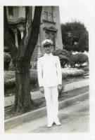 Grandpa in Navy uniform in front of boarding house in Oakland from David Schmid on Ancestry