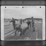 Pierced Steel Plank Is Laid On The Runway By Members Of The 834Th Engineer Aviation Battalion During Construction Of An Airfield At Furth, Germany. - Page 3