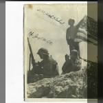 Cook, Robert Olen behind bush during WWII.jpg