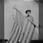 Henry C. Carico and the flag of the 1st Illinois.jpg
