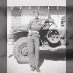 Dan Cobb in Army by jeep.jpg